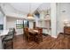 Bright dining room with a wooden table and chairs, hardwood floors at 2893 Allapattah Dr, Clearwater, FL 33761