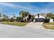 House exterior featuring a landscaped yard and a two-car garage at 2893 Allapattah Dr, Clearwater, FL 33761