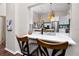 Kitchen breakfast bar with quartz countertop and two stools at 2893 Allapattah Dr, Clearwater, FL 33761