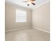 Empty bedroom with ceiling fan and window coverings at 29149 Cochiti Lake Dr, San Antonio, FL 33576