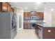 Modern kitchen with stainless steel appliances and island at 29149 Cochiti Lake Dr, San Antonio, FL 33576