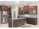 Modern kitchen with stainless steel appliances and island at 29149 Cochiti Lake Dr, San Antonio, FL 33576