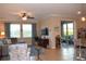 Bright and airy living room featuring a comfortable seating area and sliding glass doors at 29149 Cochiti Lake Dr, San Antonio, FL 33576