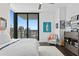 Modern bedroom with city views and relaxing armchair at 301 1St S St # 3204, St Petersburg, FL 33701