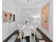 Modern dining room with white table & chairs at 301 1St S St # 3204, St Petersburg, FL 33701