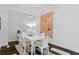 Modern dining room with white table & chairs at 301 1St S St # 3204, St Petersburg, FL 33701