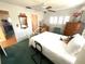 Bedroom with double bed, ceiling fan and dresser at 3182 65Th N St, St Petersburg, FL 33710