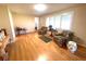 Living room with hardwood floors and access to other rooms at 3182 65Th N St, St Petersburg, FL 33710