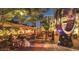 Outdoor dining area with string lights and patrons at 3182 65Th N St, St Petersburg, FL 33710