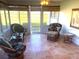 Relaxing sunroom with wicker furniture and tile floors at 3182 65Th N St, St Petersburg, FL 33710