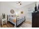 Bright bedroom with a queen-size bed and hardwood floors at 3809 Lajuana Blvd, Wesley Chapel, FL 33543