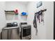 Laundry room with washer, dryer, and shelving at 3809 Lajuana Blvd, Wesley Chapel, FL 33543