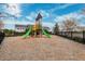 Community playground with playset and wood chips at 3809 Lajuana Blvd, Wesley Chapel, FL 33543