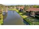 Aerial view showcasing condo building near a canal at 3833 Lighthouse Way, New Port Richey, FL 34652