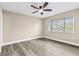 Bright bedroom with large window and ceiling fan at 3833 Lighthouse Way, New Port Richey, FL 34652