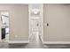 Bright hallway with neutral walls and wood-look flooring at 3833 Lighthouse Way, New Port Richey, FL 34652