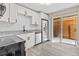 Modern kitchen featuring stainless steel appliances and white shaker cabinets at 3833 Lighthouse Way, New Port Richey, FL 34652