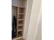 Simple closet with wooden shelves for storage at 391 Airport E Ave # 403, Venice, FL 34285