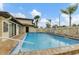 Relaxing community pool with lounge chairs at 391 Airport E Ave # 403, Venice, FL 34285