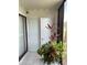 White front door entry with potted plants at 391 Airport E Ave # 403, Venice, FL 34285