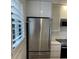 Stainless steel refrigerator in modern kitchen at 391 Airport E Ave # 403, Venice, FL 34285