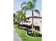 Tropical landscaping and exterior view of building at 391 Airport E Ave # 403, Venice, FL 34285