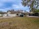 House exterior with large yard and water tank at 4228 Spring Way Cir, Valrico, FL 33596