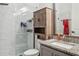 Modern bathroom with glass shower and granite vanity at 4449 Tour Trce, Land O Lakes, FL 34638