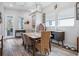 Bright dining room features a marble-top table and rattan chairs at 4449 Tour Trce, Land O Lakes, FL 34638