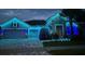 House exterior with stone and blue lighting at 4449 Tour Trce, Land O Lakes, FL 34638