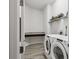 Bright laundry room with washer, dryer, and built-in counter at 4449 Tour Trce, Land O Lakes, FL 34638