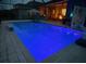 Inviting blue pool with a basketball hoop at 4449 Tour Trce, Land O Lakes, FL 34638