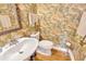 Small bathroom with pedestal sink, toilet and tropical wallpaper at 4845 W Sunset Blvd, Tampa, FL 33629