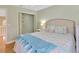 Bedroom with double bed, closet and soft color scheme at 4845 W Sunset Blvd, Tampa, FL 33629