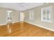 Spacious bedroom with hardwood floors and large windows at 4845 W Sunset Blvd, Tampa, FL 33629