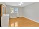 Well-lit bedroom with hardwood floors and large window at 4845 W Sunset Blvd, Tampa, FL 33629