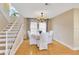 Bright dining room with hardwood floors and white chairs at 4845 W Sunset Blvd, Tampa, FL 33629