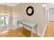 Upstairs hallway with hardwood floors and decorative desk at 4845 W Sunset Blvd, Tampa, FL 33629