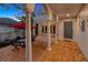 Covered patio with seating area and arched entryway at 4845 W Sunset Blvd, Tampa, FL 33629