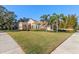 Two-story house with a well-manicured lawn at 530 Ponce De Leon Blvd, Belleair, FL 33756