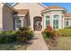 Inviting front entrance with double doors and landscaping at 530 Ponce De Leon Blvd, Belleair, FL 33756