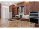 Well-equipped kitchen featuring granite countertops and stainless steel appliances at 530 Ponce De Leon Blvd, Belleair, FL 33756