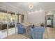 Living room with sliding doors leading to the pool area at 530 Ponce De Leon Blvd, Belleair, FL 33756