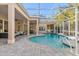 Relaxing freeform pool with spa and expansive patio at 530 Ponce De Leon Blvd, Belleair, FL 33756