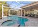 Stunning pool and spa with a screened enclosure and spacious patio at 530 Ponce De Leon Blvd, Belleair, FL 33756