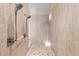 Large walk-in shower with double shower heads and tiled floors at 530 Ponce De Leon Blvd, Belleair, FL 33756