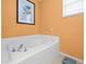 Bathroom with large bathtub and bright walls at 5537 Terrain De Golf Dr, Lutz, FL 33558