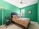 Bedroom with a queen bed and green walls at 5537 Terrain De Golf Dr, Lutz, FL 33558