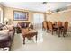 Open concept living and dining area with hardwood floors at 5537 Terrain De Golf Dr, Lutz, FL 33558