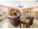 Gathering room with leather sofas, a large TV, and access to the pool at 5537 Terrain De Golf Dr, Lutz, FL 33558